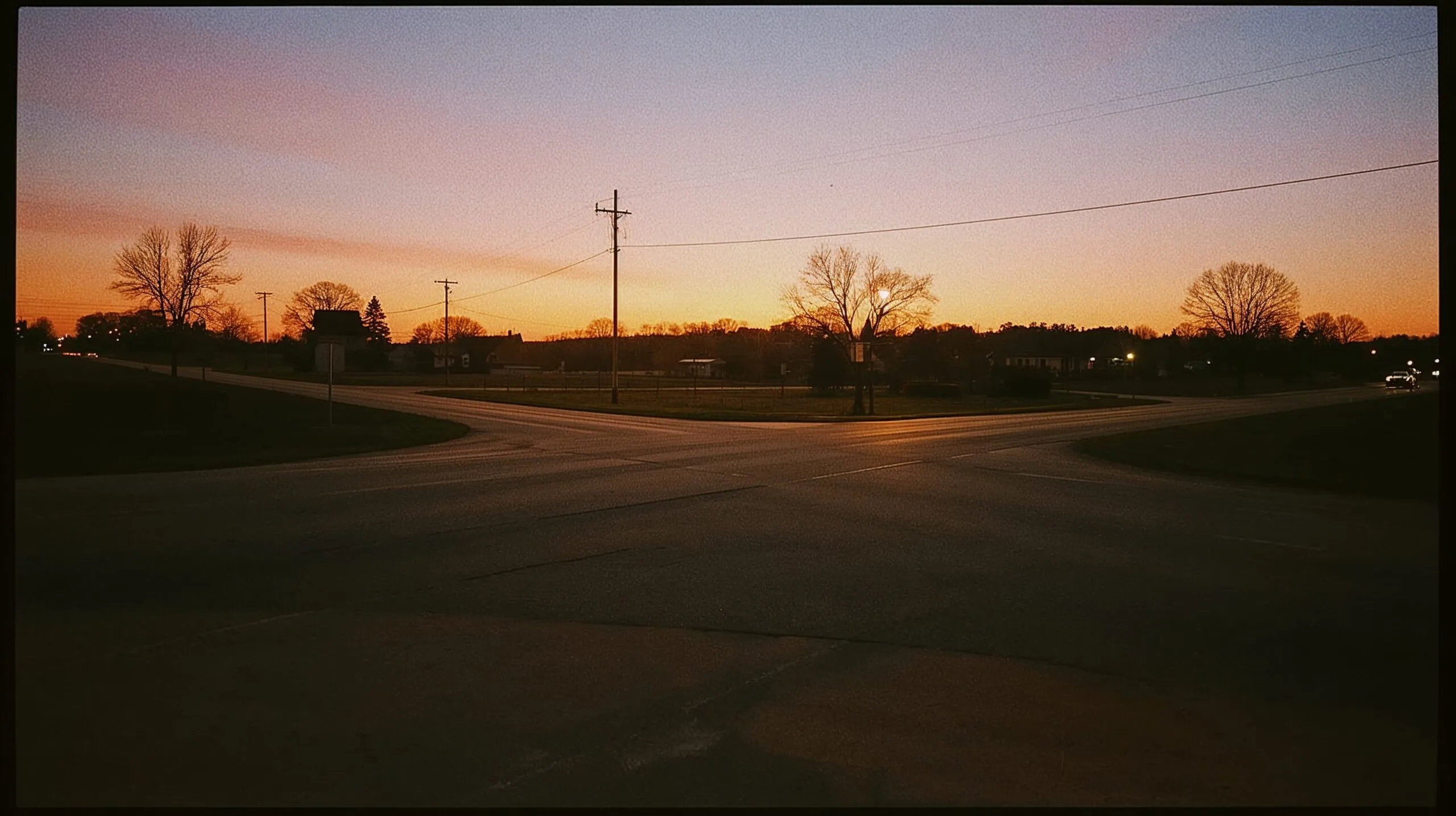 Two roads diverging — one lit with golden light, one fading into shadow